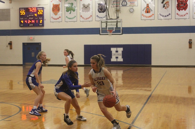 <p>Democrat photo/Kevin Labotka</p><p>Maura Pardoe gets past a defender during the Pintos’ win over Capital City in the first round of the Hermann tournament on Jan 27.</p>
