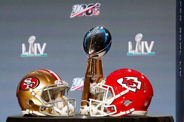 The Vince Lombardi Trophy is displayed Wednesday along with the helmets for the Chiefs and the 49ers in Miami.