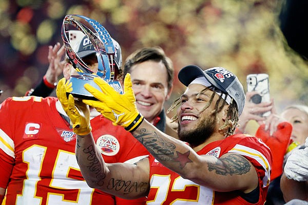 Tyrann Mathieu holds up the Lamar Hunt Trophy after the Chiefs defeated the Titans two weeks ago in the AFC Championship Game at Arrowhead Stadium.