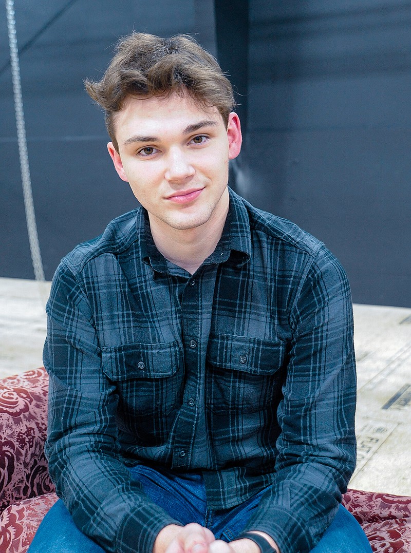 Alex Armstrong sits on the stage at Capital City Productions where construction is currently underway. Armstrong, an actor with CCP and a student at Fulton High School, was recently named best male actor in Missouri Magazine.