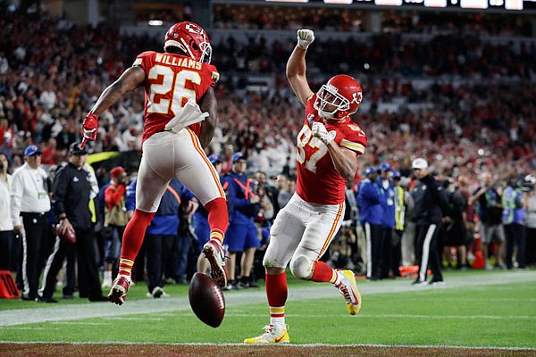 Travis Kelce celebrates his touchdown with Chiefs teammate Damien Williams during the fourth quarter of Sunday night's Super Bowl LIV against the 49ers in Miami Gardens, Fla. Kelce and Williams combined to score three touchdowns in the fourth quarter of the Chiefs' 31-20 victory.