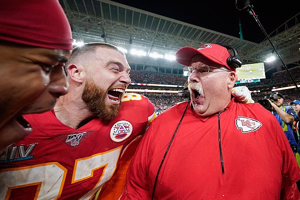 Travis Kelce celebrates with Chiefs coach Andy Reid after Sunday night's win against the 49ers in Super Bowl LIV in Miami Gardens, Fla.
