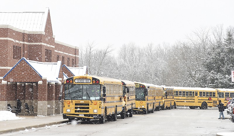 Jefferson City School District buses line up Jan. 29, 2020, at Thomas Jefferson Middle School as they drop off students for a two-hour late start due to snowfall.