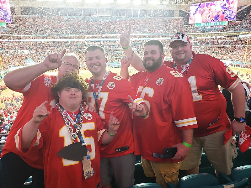 Dustin Pryor — along with his father, Chuck Pryor, and his brothers, Ryan Pryor, Devon Pryor and Donnie Knotts — show off their Chiefs' pride Sunday during the Super Bowl in Miami, Florida.