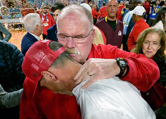 Chiefs coach Andy Reid puts his arm around 49ers coach Kyle Shanahan after Sunday night's Super Bowl LIV in Miami Gardens, Fla.