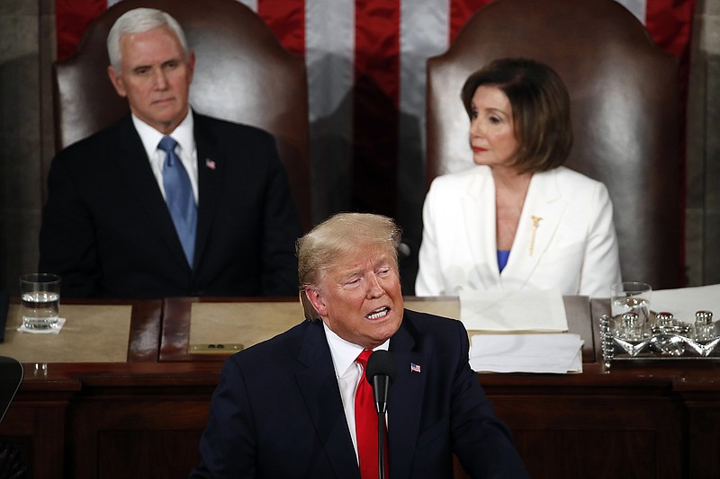 President Donald Trump delivers his State of the Union address Tuesday to a joint session of Congress on Capitol Hill in Washington as Vice President Mike Pence and House Speaker Nancy Pelosi, of California, look on.