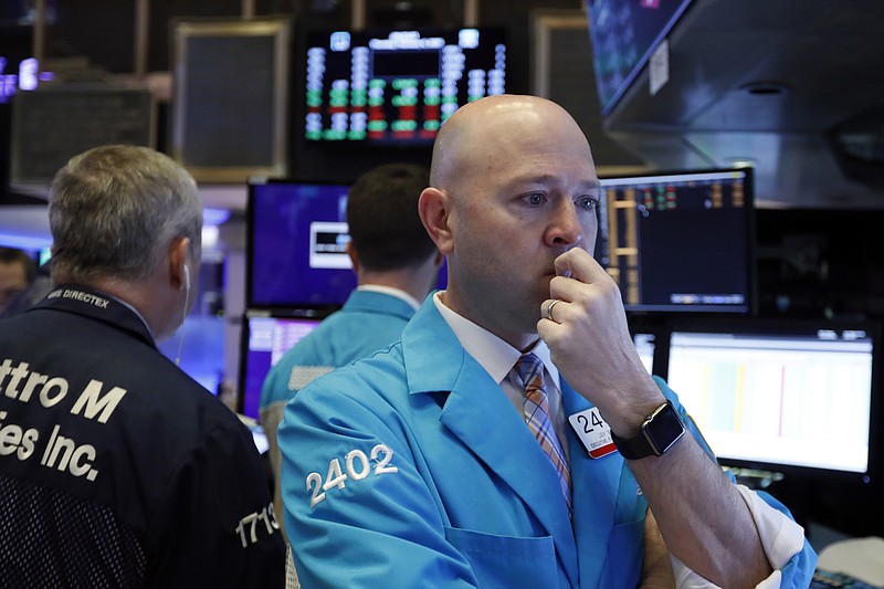 Specialist Jay Woods works at his post on the floor of the New York Stock Exchange, Thursday, Feb. 6, 2020. U.S. stocks rose in midday trading Thursday as investors continued focusing on the latest round of corporate earnings and China cut tariffs on key imports as part of a trade war truce. (AP Photo/Richard Drew)