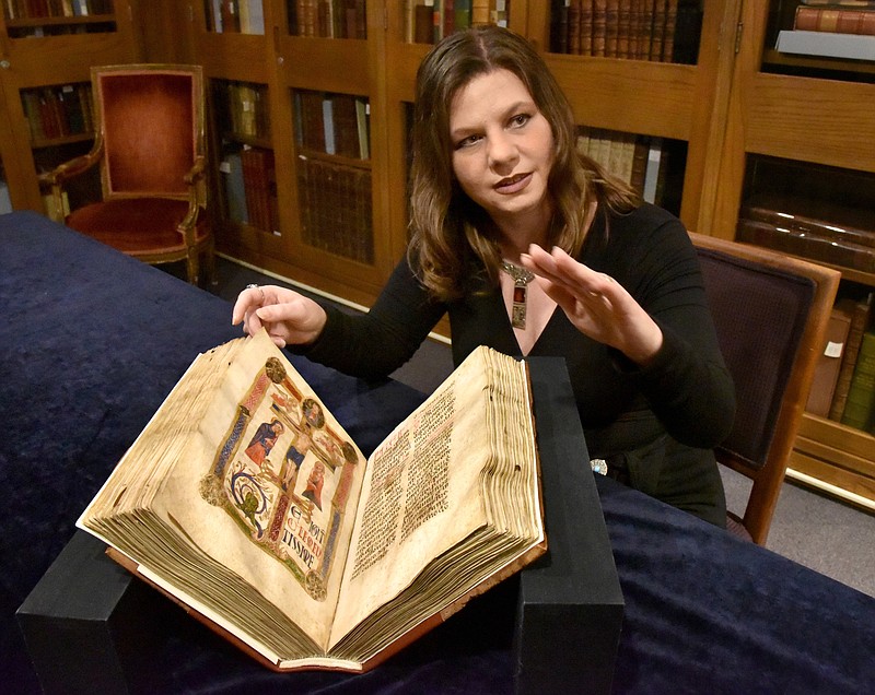 Lynley Herbert, Curator of Rare Books and Manuscripts at the Walters Art Museum, discusses a legendary item in their collection, the St. Francis Missal from Italy, circa 1200, which is once again accessible after the museum undertook a two-year conservation project. (Amy Davis/Baltimore Sun/TNS)