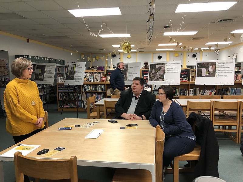 Fulton Public Schools communications Director Karen Snethen chats with Scott and Amy Lowe at a forum on Proposition S.