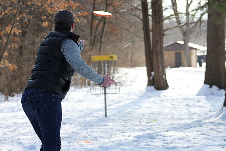 Nathan Hyde-Burton tosses a disc Saturday at the Fulton Disc Golf Club's annual Ice Bowl tournament. The tournament serves as a charity event hosted by the Fulton Disc Golf Club and allows disc golf-enthusiasts from around mid-Missouri to practice their technique.