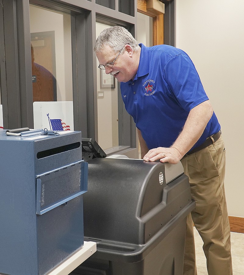 Cole County Clerk Steve Korsmeyer checked the ballot machine to get the day's count Monday, Feb. 10, 2020, of registered voters filling out the absentee ballot for the March 10 election. 