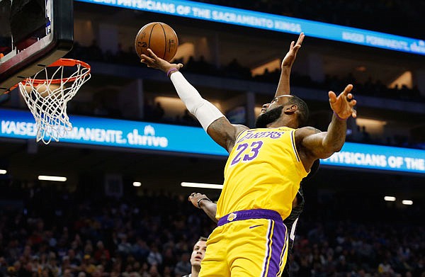 LeBron James of the Lakers goes to the basket during a game against the Kings earlier this month in Sacramento, Calif.