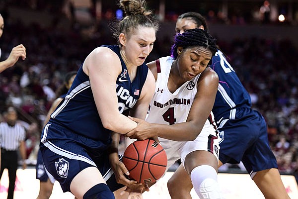 South Carolina's Aliyah Boston battles for a rebound against Connecticut guard Anna Makurat during Monday night's game in Columbia, S.C.