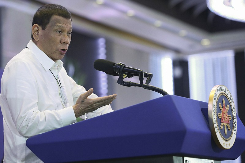 In this Monday, Feb. 10, 2020, photo provided by the Malacanang Presidential Photographers Division, Philippine President Rodrigo Duterte delivers a speech during the 11th Biennial National Convention and 22nd founding anniversary of the Chinese Filipino Business Club, Inc. in Manila, Philippines. The Philippines on Tuesday notified the United States of its intent to terminate a major security pact allowing American forces to train in the country in the most serious threat to the countriesÅf treaty alliance under President Rodrigo Duterte. (Toto Lozano/Malacanang Presidential Photographers Division via AP)