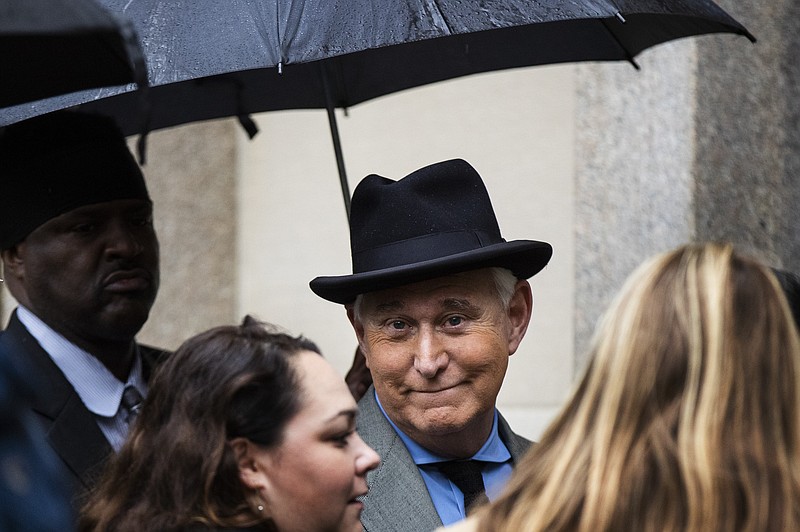 FILE - In this Nov. 12, 2019 file photo, Roger Stone, a longtime Republican provocateur and former confidant of President Donald Trump, waits in line at the federal court in Washington. A Justice Department official tells the AP that the agency is backing away from its sentencing recommendation of between seven to nine years in prison for Trump confidant Roger Stone.  (AP Photo/Manuel Balce Ceneta)