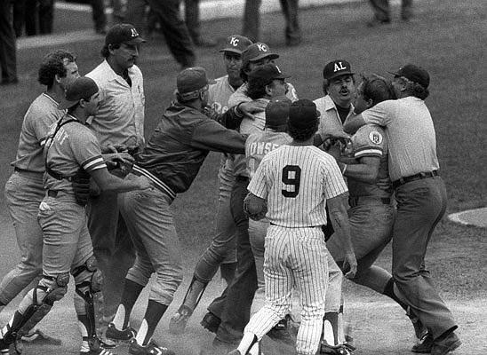 In this July 24, 1983, file photo, George Brett of the Royals (far right) is restrained by umpire Joe Brinkman after his bat was ruled illegal because of pine tar beyond the legal limit on the handle during a game against the Yankees at Yankee Stadium in New York.