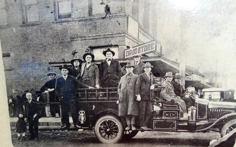 Atlanta's first fire truck appeared in 1924. Showing it off are, from left, Robert L. Miles (the child), T.A. Miles, W.F. Cameron, Marvin H. Glass, Ludie Roberts, Lee Wicks, Jim Pepper, E.C. McKinnon, Tom Johnson and Tom Howe. (Photo courtesy Citizens Journal newspaper)
