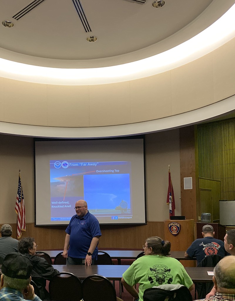 Meteorologist Chris Nuttall with the National Weather Service in Shreveport, La., talks to people taking a Skywarn Storm Spotter class Tuesday night in Texarkana. The course focused on topics such as what storm spotters should look for when reporting bad weather and the risk categories.
