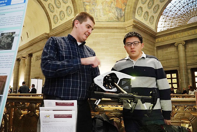 Wednesday was Lincoln University Day at the Capitol, the day where representatives of the university either set up booths to showcase their field of study or lobbied legislators for awareness and funding. To that end, Austen Dudenhoeffer, left, GIS technician for the university, and master's degree student Ethan Zhao discuss the use of drones in agricultural mapping.
