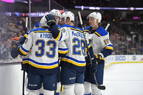 Jay Bouwmeester (far right) celebrates with his Blues teammates after a goal in the first period of Tuesday night's game against the Ducks in Anaheim, Calif.