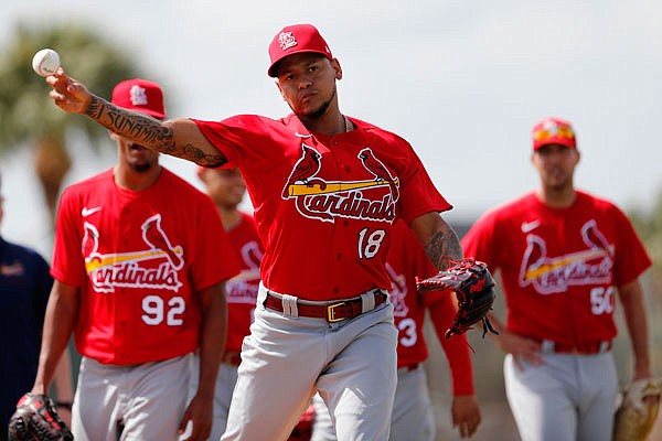 Cardinals pitcher Carlos Martinez throws during a spring training baseball drill Wednesday in Jupiter, Fla.