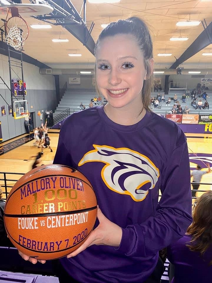 Fouke senior Mallory Oliver holds the basketball commemorating her 1,000th career point, which she scored Feb. 7 against Centerpoint. (Submitted photo)
