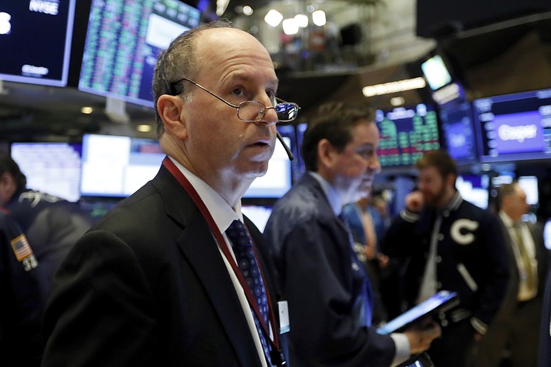 FILE - In this Feb. 6, 2020, file photo trader Gordon Charlop works on the floor of the New York Stock Exchange. The U.S. stock market opens at 9:30 a.m. EST on Thursday, Feb. 13. (AP Photo/Richard Drew, File)