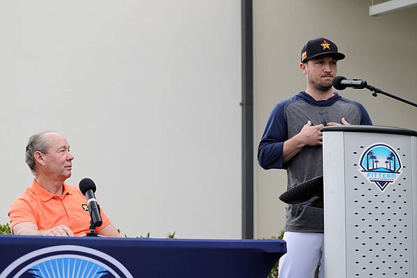 Alex Bregman of the Astros delivers a statement as Astros owner Jim Crane listens during a news conference Thursday in West Palm Beach, Fla.