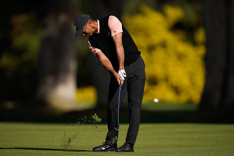 Tiger Woods hits his third shot on the 13th hole during the first round of the Genesis Invitational golf tournament at Riviera Country Club, Thursday, Feb. 13, 2020, in the Pacific Palisades area of Los Angeles. (AP Photo/Ryan Kang)