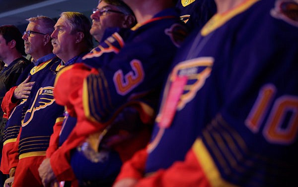 The fathers of Blues players stand for the national anthem prior Thursday night's game against the Golden Knights in Las Vegas.