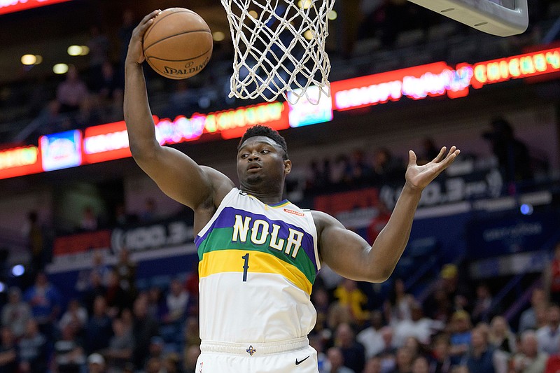 New Orleans Pelicans forward Zion Williamson grabs a rebound during the first half of the team's NBA basketball game against the Oklahoma City Thunder in New Orleans, Thursday, Feb. 13, 2020. (AP Photo/Matthew Hinton)