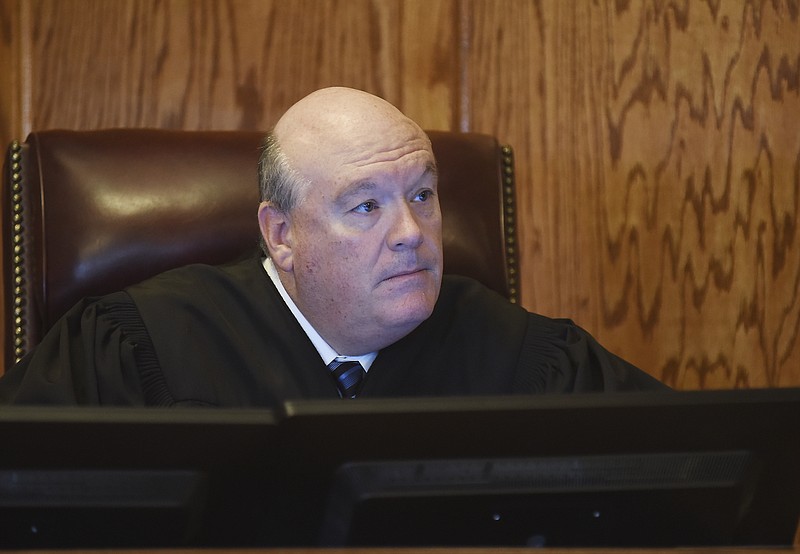 Judge Dan Green listens to attorneys at the start of Kurt Steidley's trial. 