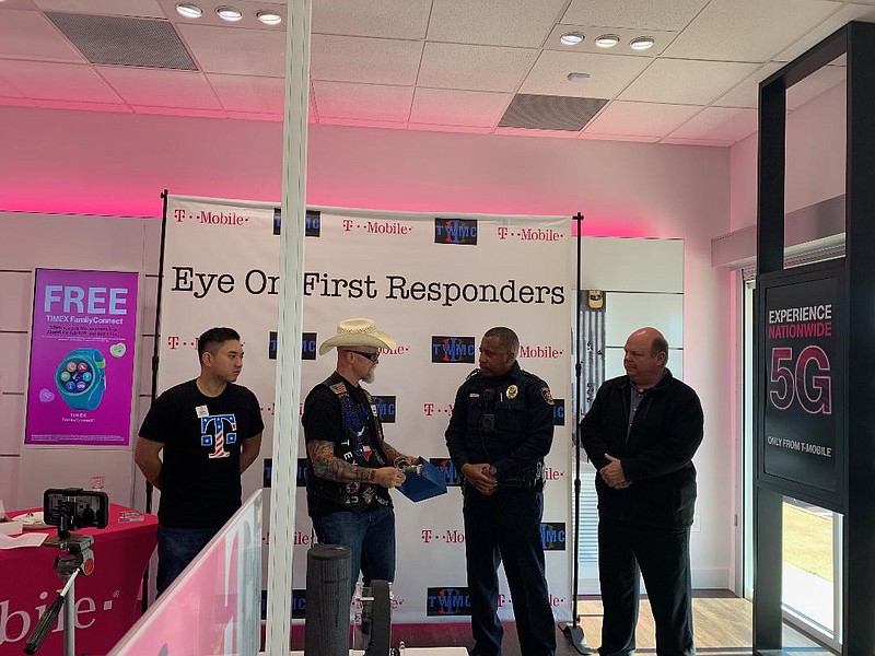 Texarkana, Texas, Police Officer Karey Parker receives the Third Watch Law Enforcement Motorcycle Club Eye on First Responders Award Friday at the T-Mobile store on St. Michael Drive. T-Mobile sponsors the award. From left to right, store manager Ronald Le, Third Watch Vice President Greg "Mongo" Campbell, Parker and TTPD Chief Kevin Schutte.