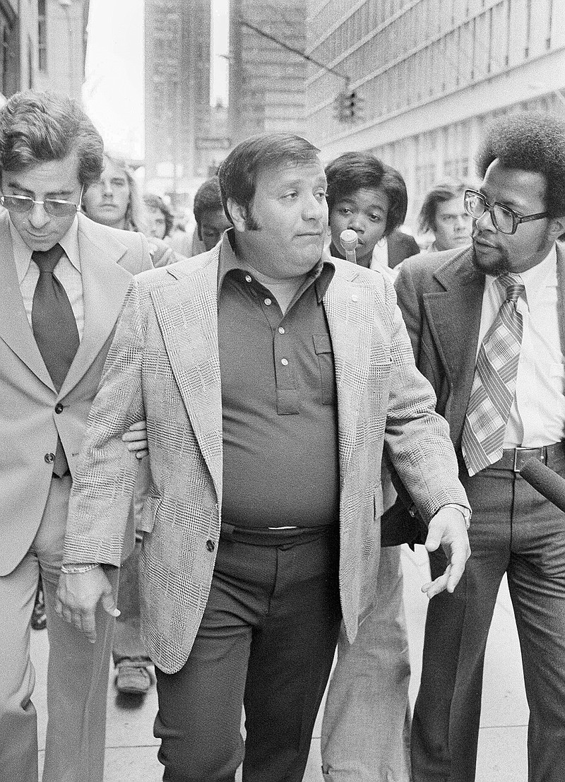 In this Sept. 4, 1975 file photo, Charles O'Brien,  Jimmy Hoffa's adopted son, leaves the federal court building in Detroit.  O'Brien, a longtime associate of the late Jimmy Hoffa who became a leading suspect in the Teamsters boss' disappearance, has died. O'Brien's stepson, Harvard Law School professor Jack Goldsmith, said in a blog post that O'Brien died Thursday, Feb. 13m 2020 in Boca Raton, Fla., from what appeared to be a heart attack. (AP Photo/Richard Sheinwald, File)