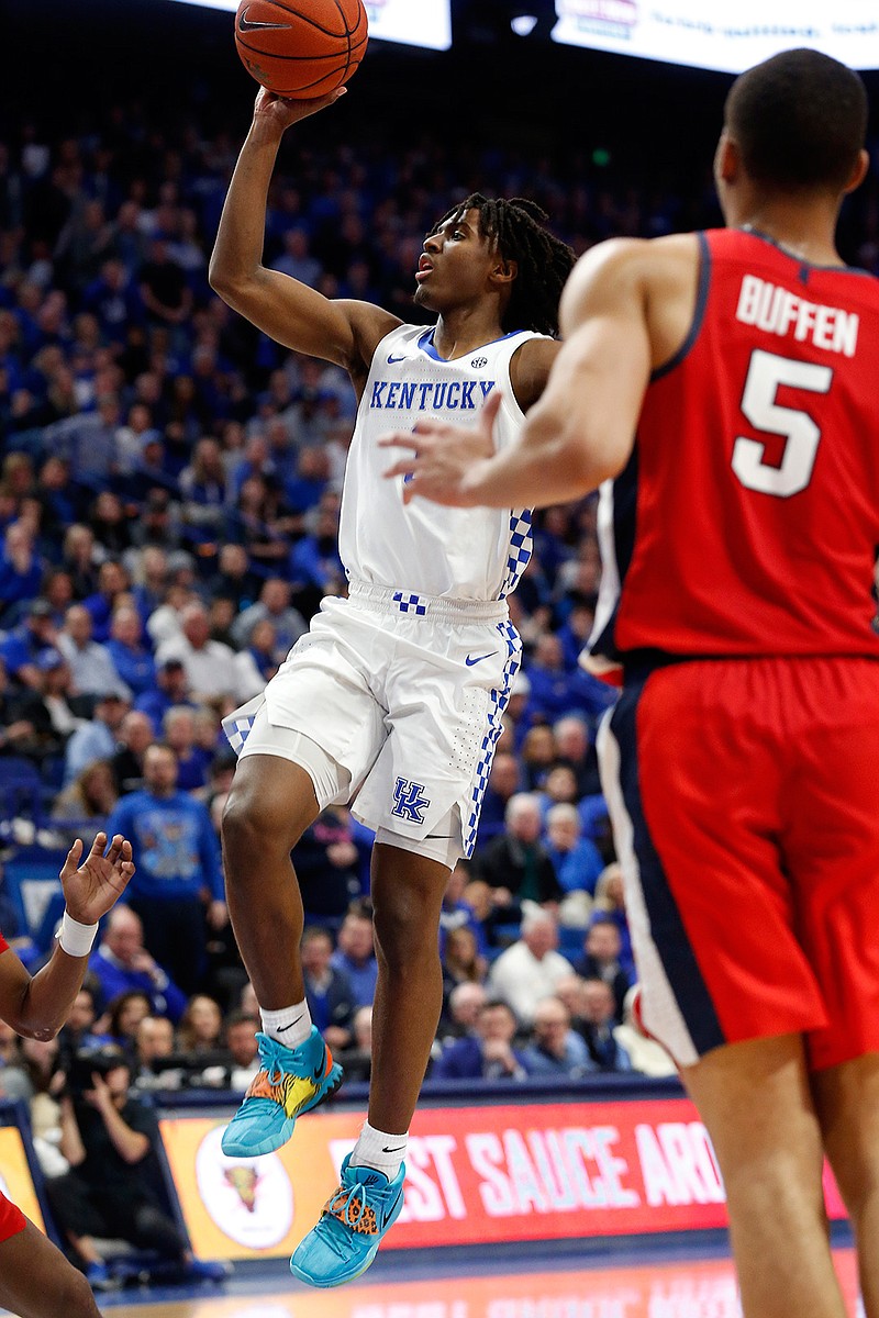 Kentucky's Tyrese Maxey, left, shoots near Mississippi's KJ Buffen (5) in the second half of an NCAA college basketball game in Lexington, Ky., Saturday, Feb. 15, 2020. Kentucky won 67-62. (AP Photo/James Crisp)