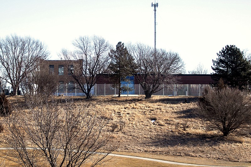 In this Feb. 13, 2020 photo, a fence surrounds the Youth Rehabilitation and Treatment Center in Kearney, Neb. Two state-run homes for Nebraska's high-risk juvenile offenders are facing new scrutiny after a string of high-profile escapes and violence. The incidents at the Youth Rehabilitation and Treatment Centers in central Nebraska have escalated to the point that state officials are moving the most violent youths to separate facilities and lawmakers are proposing millions of dollars in facility upgrades to try to keep them and the adults who treat them safe. (Kayla Wolf/Omaha World-Herald via AP)