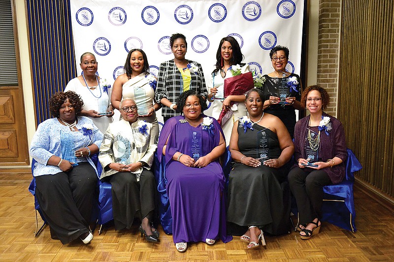 Honored Saturday evening as Prominent Women of Vision were, seated from left: Cynthia Lamay, Cathie Murphy, Angela Taylor, Tina Maxwell and D.C. Gomez. Standing from left: Angela Lester, Taryn Chambers Givan, Dr. Jackie Otto, Brigette Biley and Bobbie McGee.