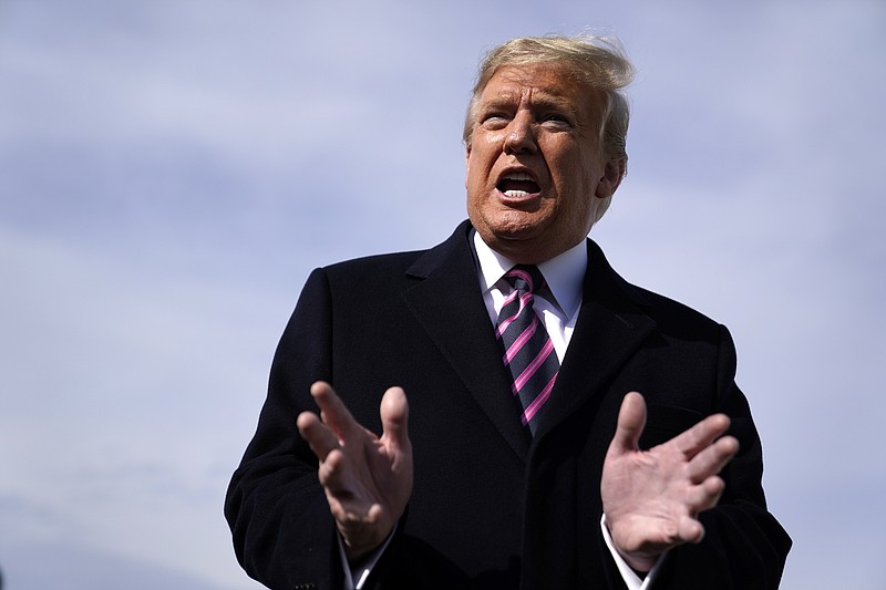 President Donald Trump talks to the media before he boards Air Force One for a trip to Los Angeles to attend a campaign fundraiser, Tuesday, Feb. 18, 2020, at Andrews Air Force Base, Md. (AP Photo/Evan Vucci)