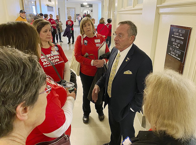 Rep. Dave Griffith, R-Jefferson City, stopped outside his Capitol office Tuesday to hear concerns from members of the Moms Demand Action group who were in the Capitol to advocate for legislation to limit gun violence in domestic abuse cases.