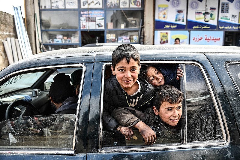 Civilians flee from Idlib toward the north to find safety inside Syria near the border with Turkey, Saturday, Feb. 15, 2020. Syrian troops are waging an offensive in the last rebel stronghold. (AP Photo)