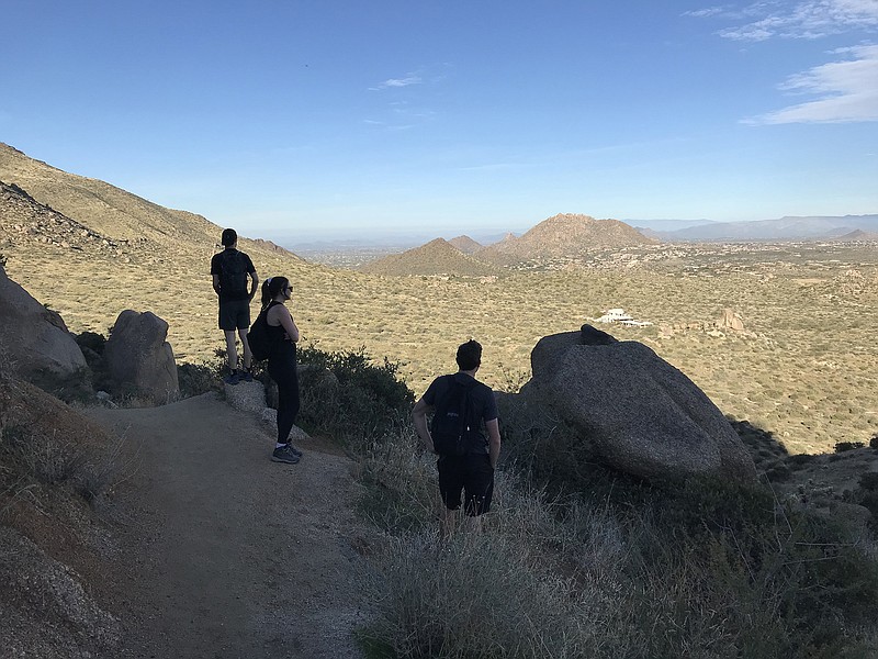 Hikers along Tom's Thumb Trail in Scottsdale, Ariz., stop to take in the view. (Amy Bertrand/St. Louis Post-Dispatch/TNS)