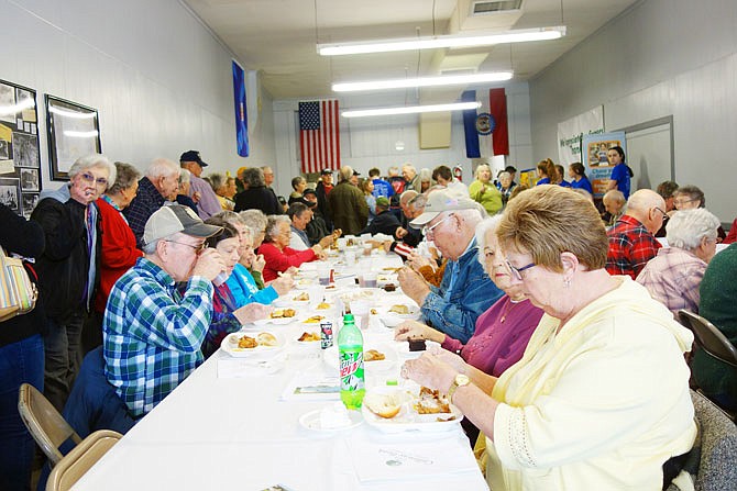 Loafers enjoy a fried chicken lunch during Auxvasse Loafers Week in 2020. Organizer Donal Knipp said fried chicken is always a popular meal.