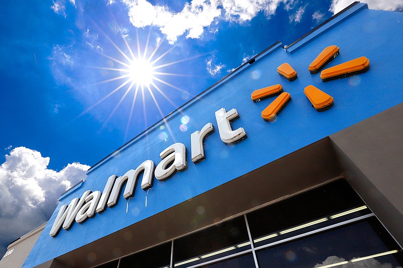 This June 25, 2019, file photo shows the entrance to a Walmart in Pittsburgh. Walmart is reporting  disappointing fourth-quarter profits and sales. The nation's largest retailer says that sales at its U.S. stores heading into the holiday season were weaker than expected. It also said that social unrest in Chile hurt its business. (AP Photo/Gene J. Puskar, File)