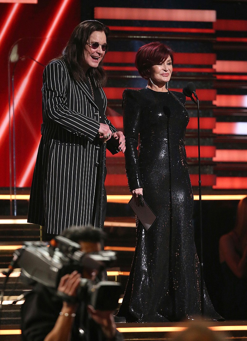 Ozzy Osbourne, left, and Sharon Osbourne present the award for best rap/sung performance at the 62nd annual Grammy Awards on Sunday, Jan. 26, 2020, in Los Angeles. (Photo by Matt Sayles/Invision/AP)