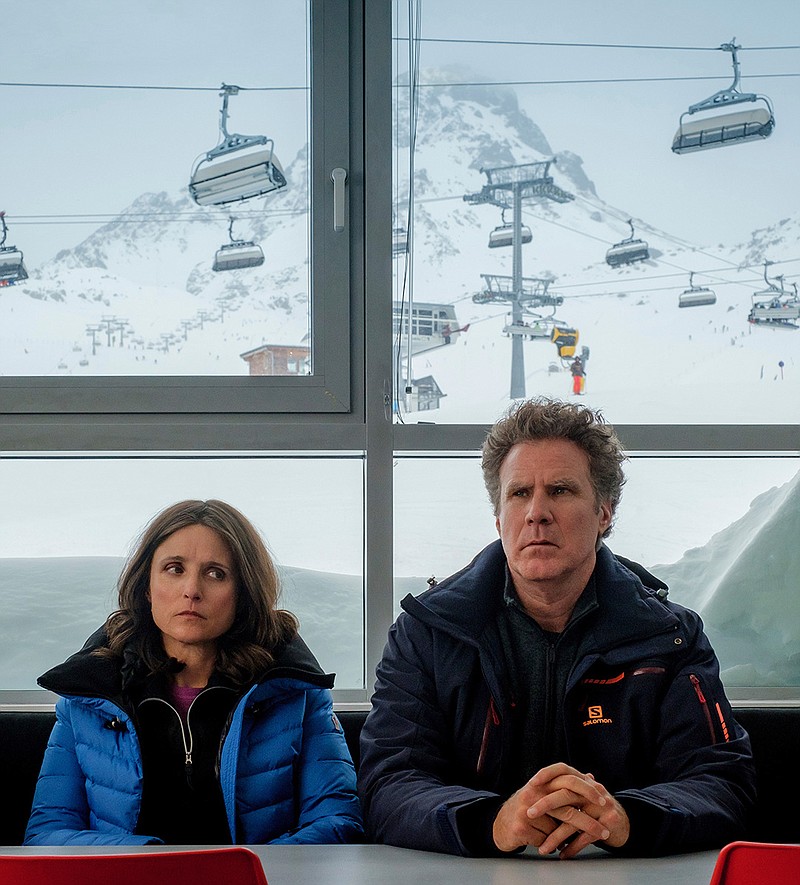 This image released by Fox Searchlight shows Julia Louis-Dreyfus, left, and Will Ferrell in a scene from "Downhill," a remake of the Swedish film "Force Majeure."  (Jaap Buitendijk/Fox Searchlight via AP)