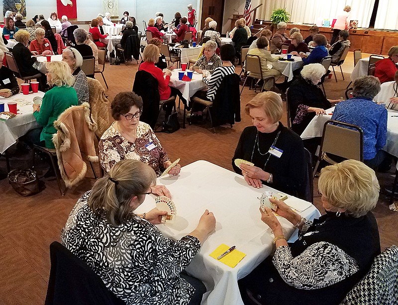 Patti Lyle, foreground from left, Gay Thompson, Deborah Nuckolls and Gail Cooper play cards at the annual Game Day fundraiser for the Salvation Army Women's Auxiliary on Thursday, Feb. 20, 2020, in Texarkana, Arkansas. Participants paid $25 each or $100 per table for lunch and a day of games.