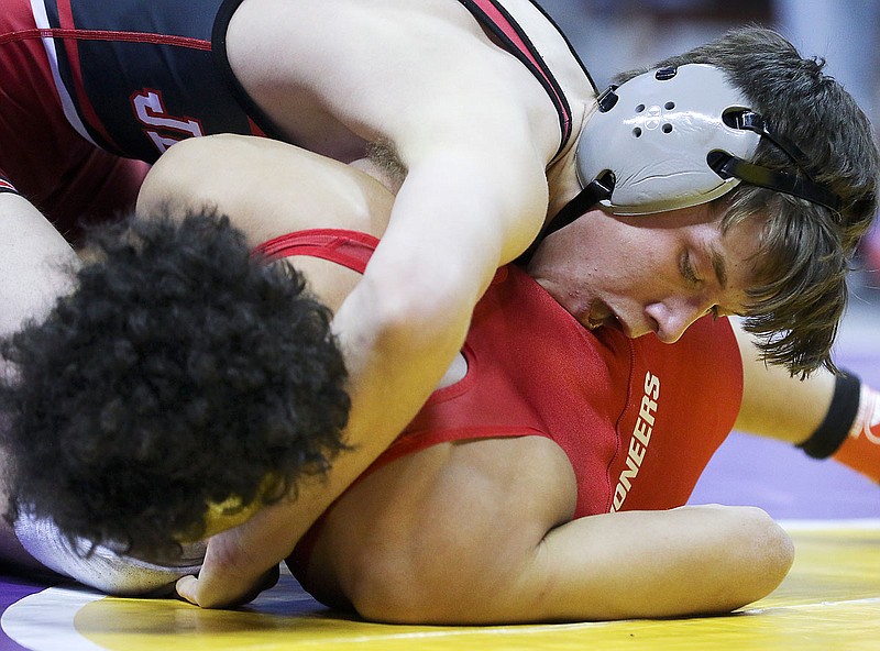 Jefferson City's Joe Kuster tries to keep Kirkwood's Noah Bourke down Thursday during a 132-pound match in the Class 4 state wrestling championships at Mizzou Arena in Columbia.