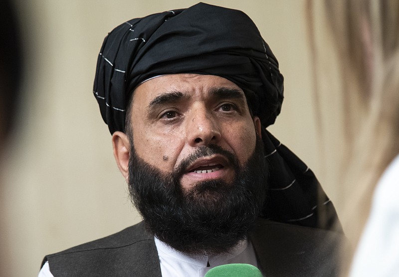 FILE - In this May 28, 2019 file photo, Suhail Shaheen, spokesman for the Taliban's political office in Doha, speaks to the media in Moscow, Russia.   The countdown to the signing of a peace agreement between the Taliban and the United States to end the 18 years of war in Afghanistan will begin on Friday night, when the seven-day “reduction of violence" promised by the Taliban will go into effect, a senior U.S. State Department official said. The deal will be signed on Feb. 29. (AP Photo/Alexander Zemlianichenko, File)