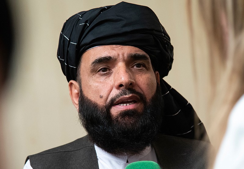 In this May 28, 2019 file photo, Suhail Shaheen, spokesman for the Taliban's political office in Doha, speaks to the media in Moscow, Russia.   The countdown to the signing of a peace agreement between the Taliban and the United States to end the 18 years of war in Afghanistan will begin on Friday night, when the seven-day "reduction of violence" promised by the Taliban will go into effect, a senior U.S. State Department official said. The deal will be signed on Feb. 29. (AP Photo/Alexander Zemlianichenko, File)