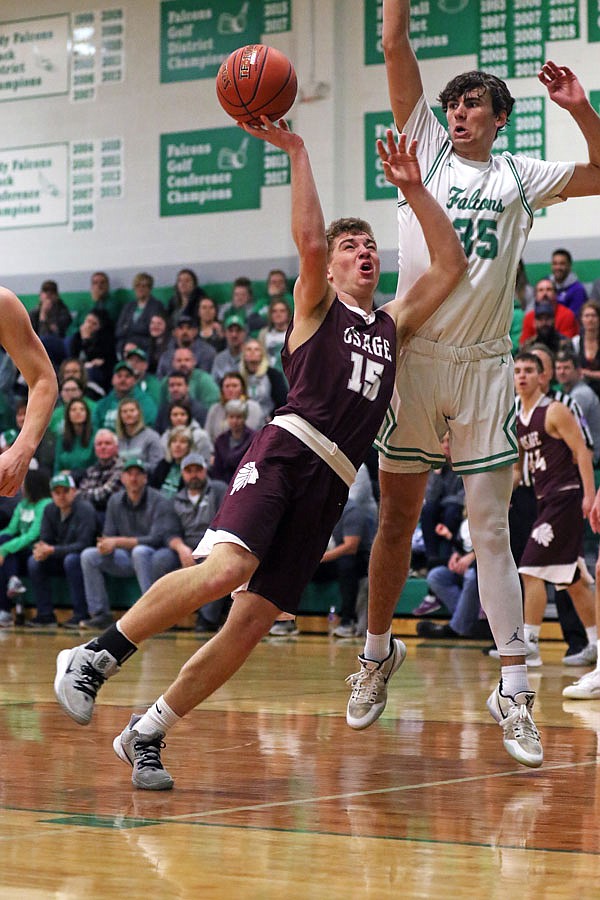 Eric Northweather of Blair Oaks attempts to block the shot of School of the Osage's Logan Havner during Friday night's game in Wardsville.